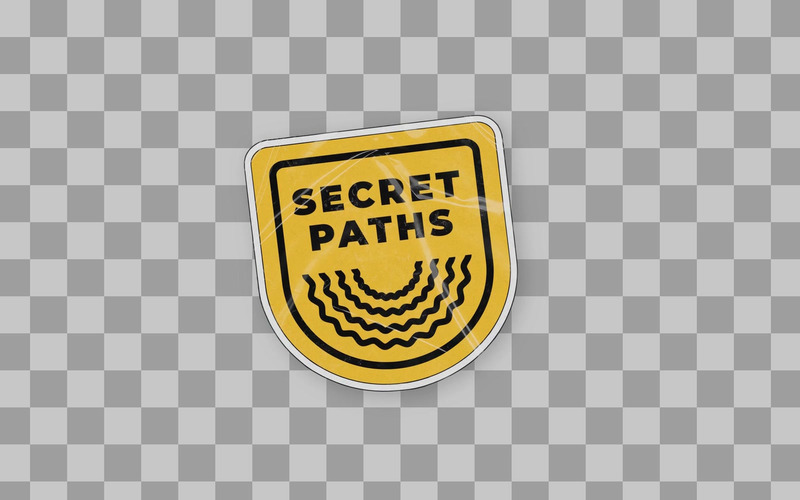 Gele sticker met badge 'Geheime Paden' - Features Image 1